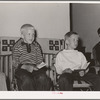 Children singing at boys' camp fireside meeting. El Porvenir, New Mexico