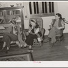 Women staying at nearby lodge listening to the boys in the summer camp singing. El Porvenir, New Mexico