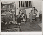 Women staying at nearby lodge listening to the boys in the summer camp singing. El Porvenir, New Mexico