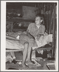 Daughter of family living in Mays Avenue camp. Oklahoma City, Oklahoma. This family had been farmers in Oklahoma until four years ago