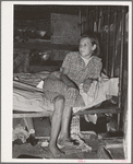 Daughter of family living in Mays Avenue camp. Oklahoma City, Oklahoma. This family had been farmers in Oklahoma until four years ago