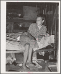 Daughter of family living in Mays Avenue camp. Oklahoma City, Oklahoma. This family had been farmers in Oklahoma until four years ago