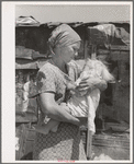 Mother and child in front of shack in Mays Avenue camp. Oklahoma City, Oklahoma. Refer to general caption no. 21