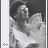 Shakespeare in the Park, woman with fan in audience