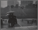 People in the rain at the East River Park Amphitheatre