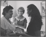 Actress Colleen Dewhurst visits residents of an apartment complex
