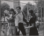 New York Shakespeare Festival actors J. D. Cannon and Colleen Dewhurst (right) play with children at the East River Park Amphitheatre during the run of The Taming of the Shrew