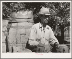 Water peddler in community camp. Oklahoma City, Oklahoma. He is paid fifteen cents a barrel for delivering water to the shack homes