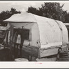Covered trailer in community camp. Oklahoma City, Oklahoma