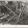 Old plows and wornout tires. Testimonial to the sources of the residents of the community camp. Oklahoma City, Oklahoma