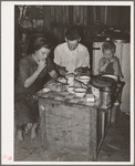 Family eating breakfast. Mays Avenue camp, Oklahoma City, Oklahoma