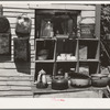 Pans and outdoor kitchen cupboard of family living near Mays Avenue camp. Oklahoma City, Oklahoma