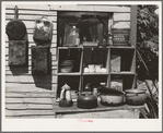 Pans and outdoor kitchen cupboard of family living near Mays Avenue camp. Oklahoma City, Oklahoma