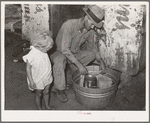 Resident of Mays Avenue camp under the bridge, covering milk with wet cloth in order to keep it cool. Many residents of this camp sneak into stockyards early in the morning to milk cows