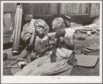 Children of Mays Avenue camp. Oklahoma City, Oklahoma. Their father is a trasher and they are playing with some things he picked up