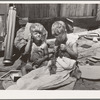 Children of Mays Avenue camp. Oklahoma City, Oklahoma. Their father is a trasher and they are playing with some things he picked up