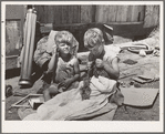 Children of Mays Avenue camp. Oklahoma City, Oklahoma. Their father is a trasher and they are playing with some things he picked up