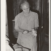 Wife of tenant farmer slicing fatback for noonday meal near Muskogee, Oklahoma