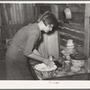 Resident of Mays Avenue camp making biscuits. Oklahoma City, Oklahoma