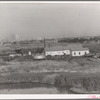 Independent refinery. Business section of Oklahoma City, Oklahoma in background