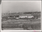 Independent refinery. Business section of Oklahoma City, Oklahoma in background