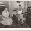 Truck driver, his mother and son at home. Seminole, Oklahoma, oil fields