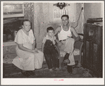 Truck driver, his mother and son at home. Seminole, Oklahoma, oil fields