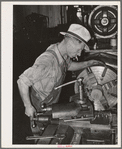 Machinist working at lathe. Seminole, Oklahoma, oil refinery