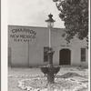 Town hall and light standard. Cimarron, New Mexico