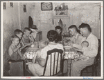 Family of unemployed oil worker, who is now living on relief, eating supper. Seminole, Oklahoma
