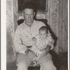 Unemployed oil worker and his baby. Seminole, Oklahoma