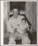 Unemployed oil worker and his baby. Seminole, Oklahoma