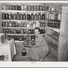 Mrs. Schoenfeldt, FSA (Farm Security Administration) client, in Sheridan County, Kansas, in fruit cellar