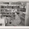 Mrs. Schoenfeldt, FSA (Farm Security Administration) client, in Sheridan County, Kansas, in fruit cellar