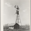 Old windmill and shed on abandoned farm near Syracuse, Kansas