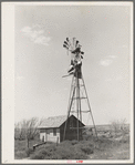 Old windmill and shed on abandoned farm near Syracuse, Kansas