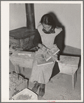 Spanish-American woman carding wool at WPA (Works Progress Administration/Work Projects Administration) project. Costilla, New Mexico