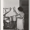 Daughter of Spanish-American family bringing in the wood near Taos, New Mexico