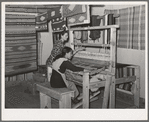 Spanish-American woman weaving a rag rug at WPA (Works Progress Administration/Work Projects Administration) project. Costilla, New Mexico