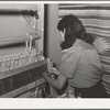 Spanish-American girl threading the loom at WPA (Works Progress Administration/Work Projects Administration) weaving project. Costilla, New Mexico