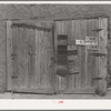 Garage door of Spanish-American farmer near Questa, New Mexico