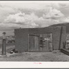 Garage and old gasoline pump on Spanish-American farm near Questa, New Mexico