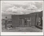 Garage and old gasoline pump on Spanish-American farm near Questa, New Mexico