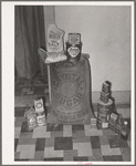 One Spanish-American FSA (Farm Security Administration) client following the live-at-home program buys only the pictured supplies at the grocery store. Near Taos, New Mexico