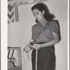 Spanish-American girl makes skein of woolen thread at WPA (Works Progress Administration/Work Projects Administration) project. Costilla, New Mexico