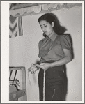 Spanish-American girl makes skein of woolen thread at WPA (Works Progress Administration/Work Projects Administration) project. Costilla, New Mexico