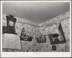 Corner of living room of Spanish-American family near Taos, New Mexico. Notice lace decorations