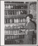 FSA (Farm Security Administration) client with canned goods. Farm, Bradford, Vermont, Orange County