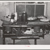 Pies, canned goods and household articles on stove in farm home. Bradford, Vermont, Orange County