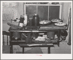 Pies, canned goods and household articles on stove in farm home. Bradford, Vermont, Orange County